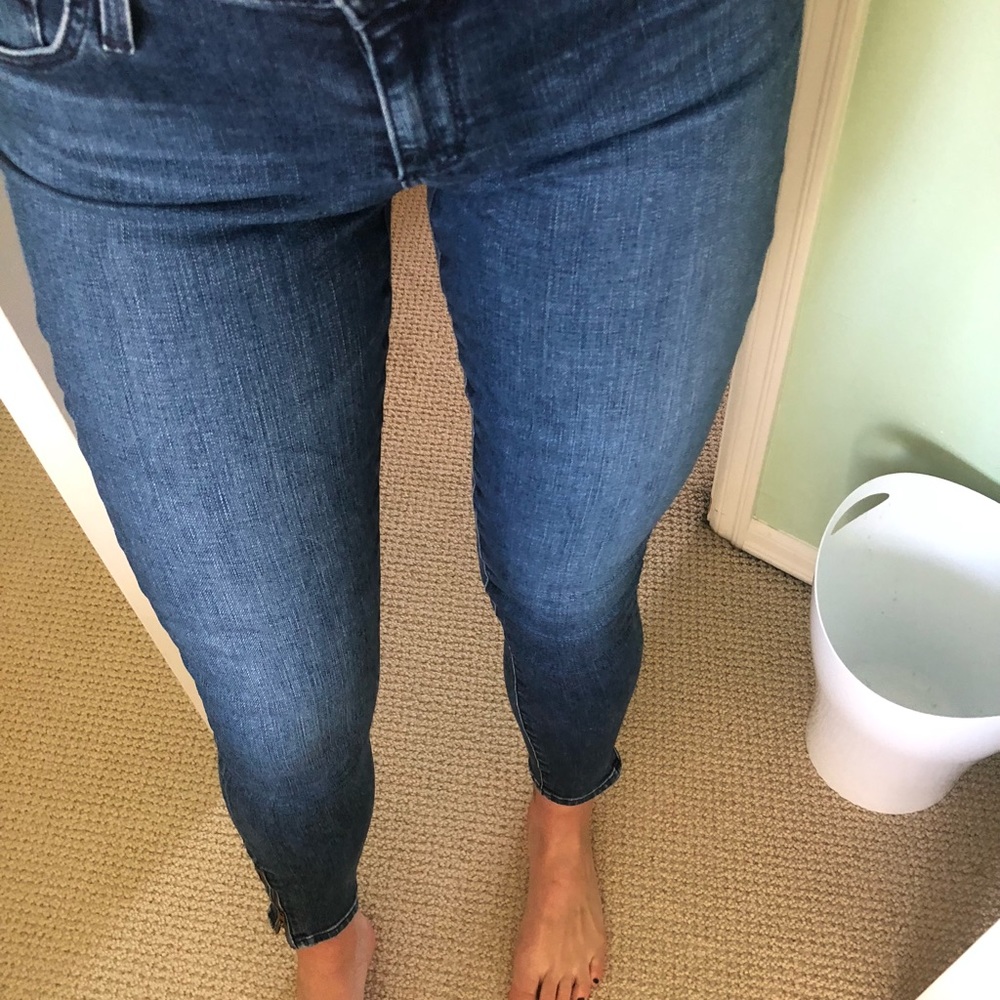 AG mid rise skinny jeans with zipper on bottom